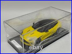 1/18 MotorHelix Model of the Aston Martin DB12 coupe in Yellow