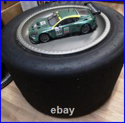 Aston Martin DBR9 118 scale model on actual used racing slick mancave display