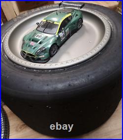 Aston Martin DBR9 118 scale model on actual used racing slick mancave display