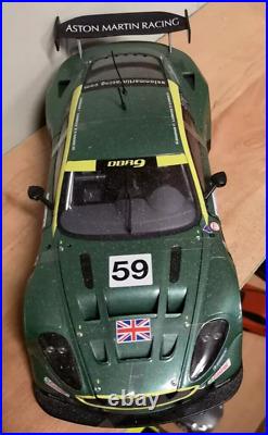 Aston Martin DBR9 118 scale model on actual used racing slick mancave display