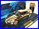 Minichamps_137621_James_Bonds_Gold_Plated_Aston_Martin_DBS_in_143_Scale_01_agao